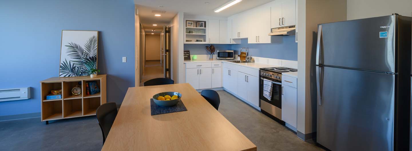 interior shot of kitchen and dining room at pepper canyon west apartment
